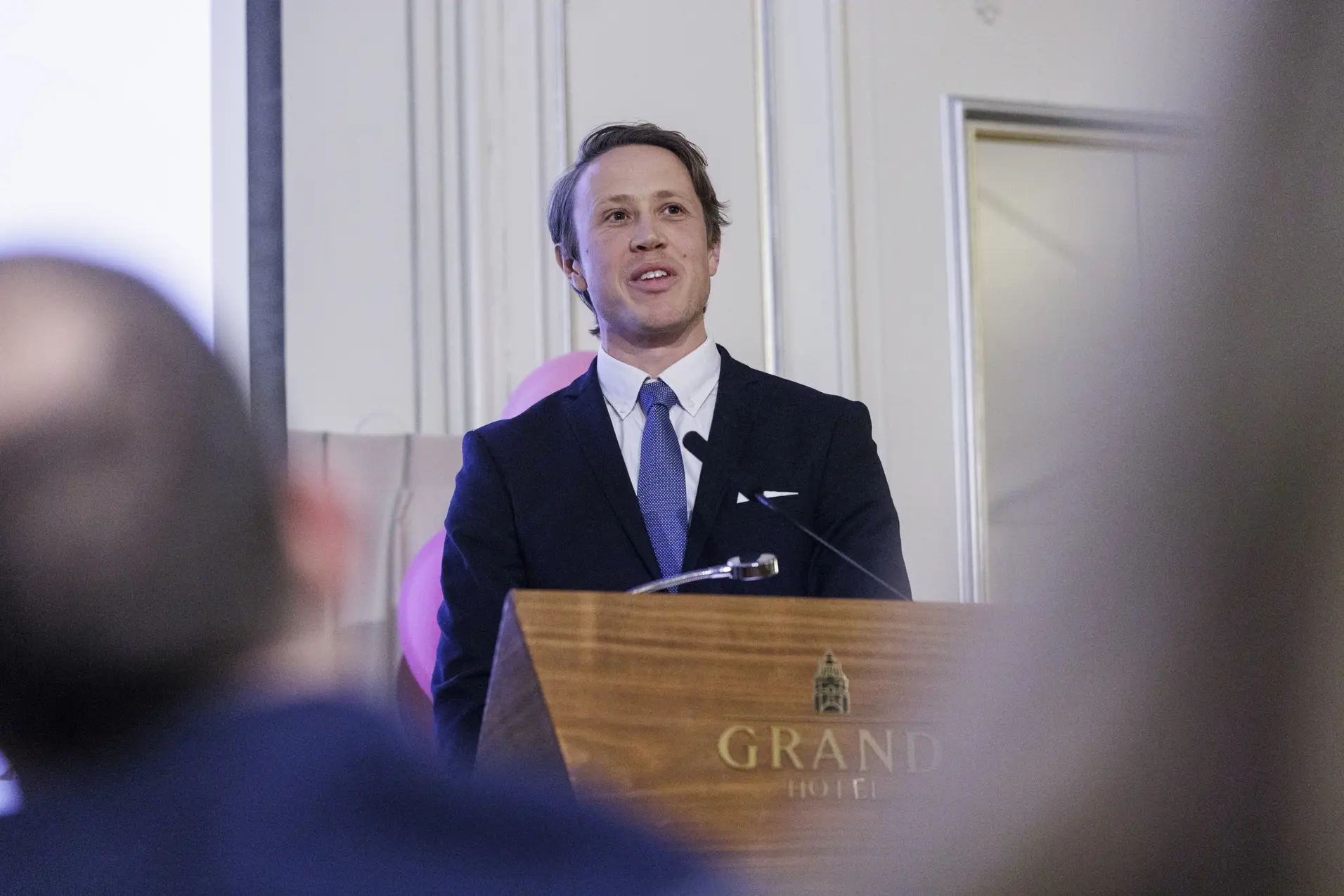 Peder Myhre at the speaker's platform at Grand Hotell