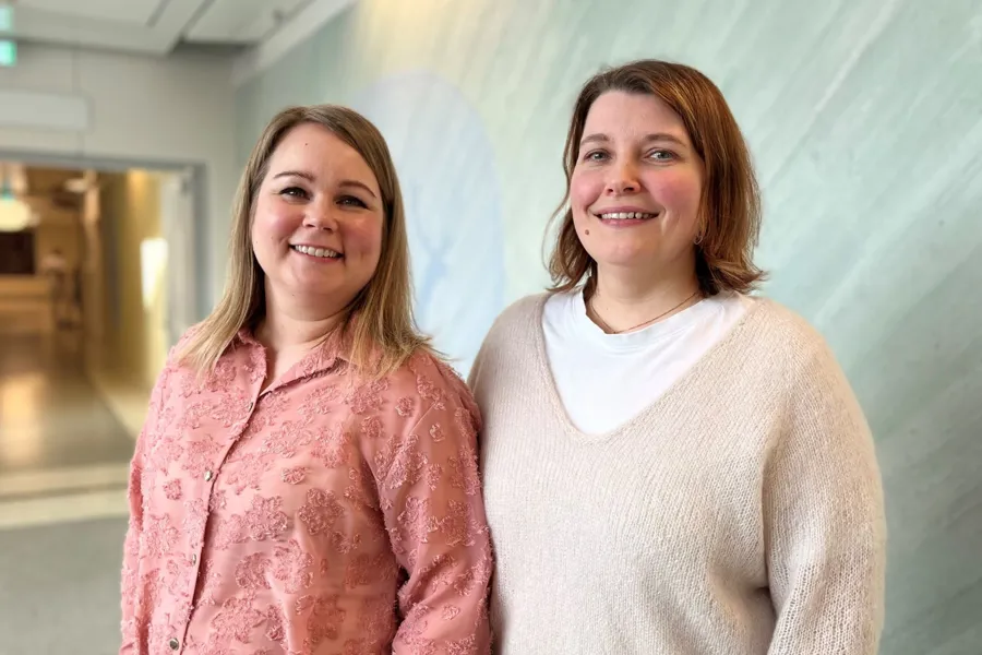 A couple of women smiling